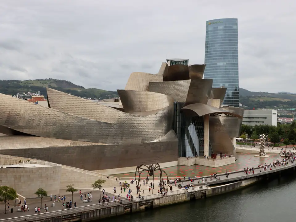 Aerial view of the Guggenheim Museum Bilbao and Iberdrola Tower, showcasing contemporary architecture
