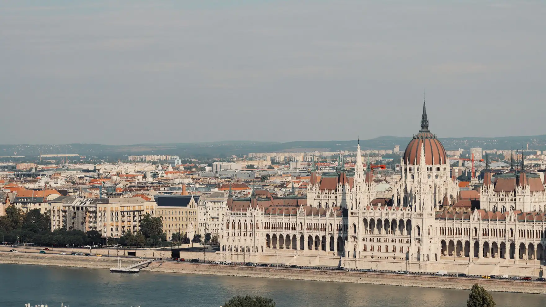 Scenic view of the iconic Hungarian Parliament Building along the Danube River in Budapest