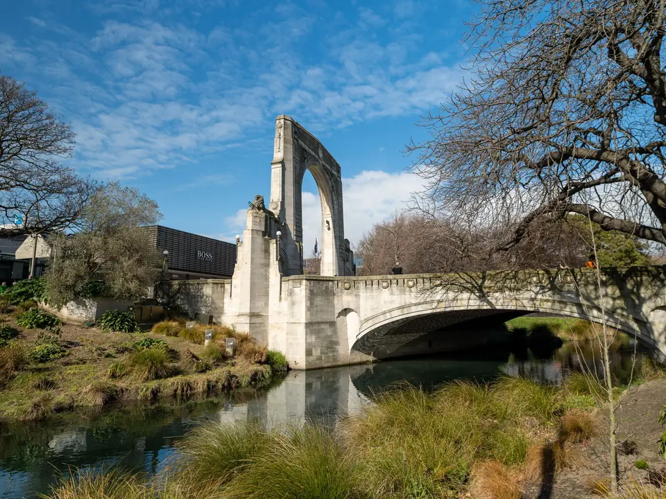 Scenic view of the Bridge of Remembrance in Christchurch, New Zealand, spanning the Avon River