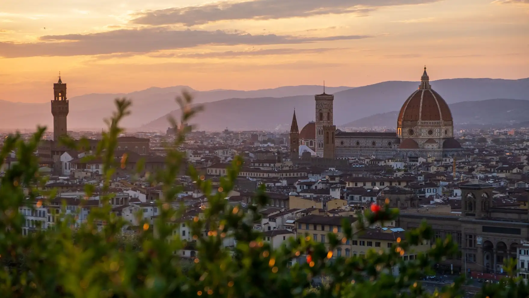 A stunning view of Florence, Italy, with the Duomo and skyline at sunset