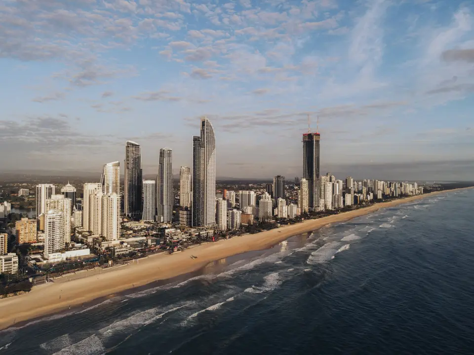 Stunning aerial image of Gold Coast's skyline along the beach at sunrise