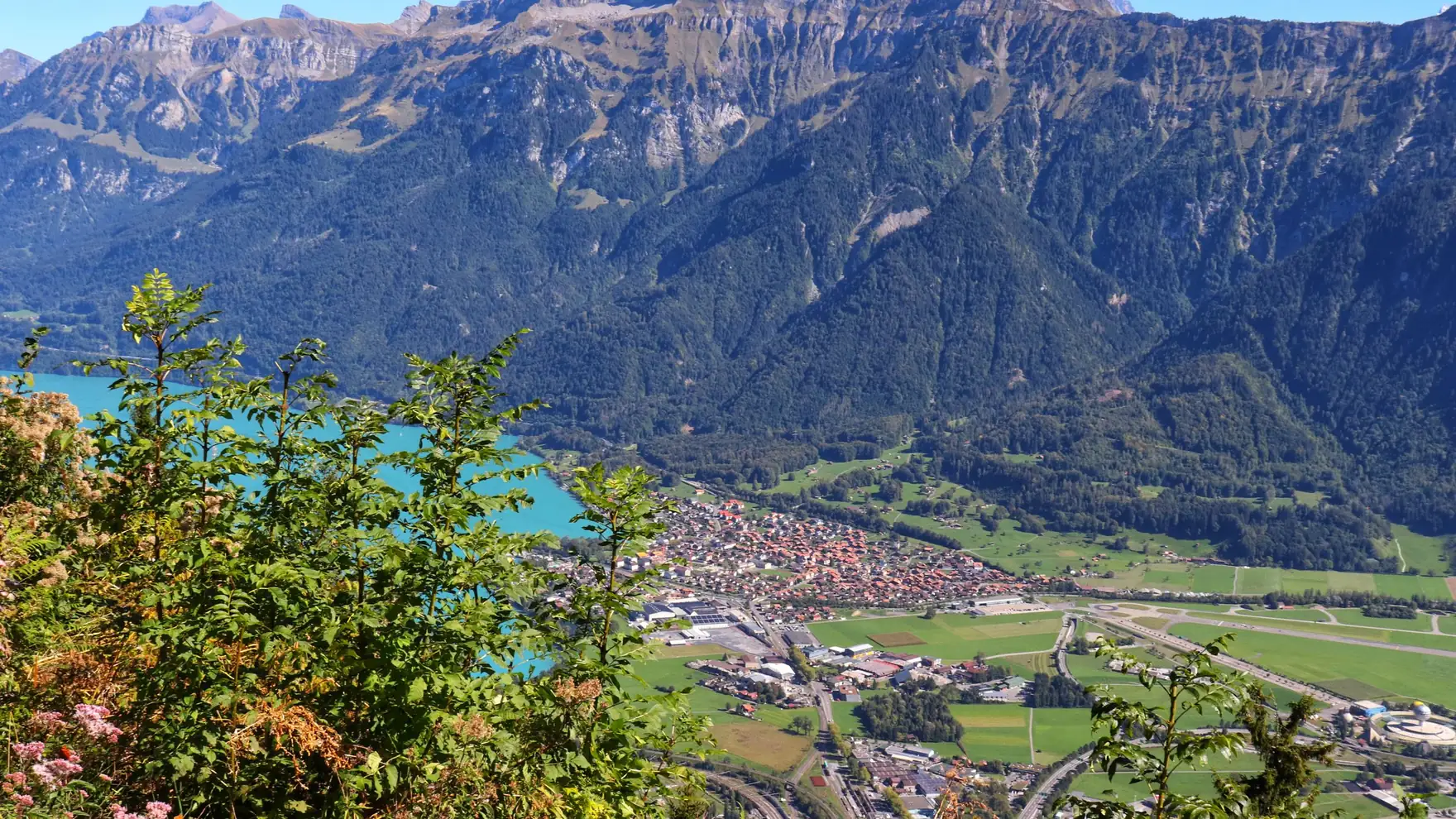 A stunning aerial view of Interlaken, nestled between mountains and lakes, viewed from Harder Kulm