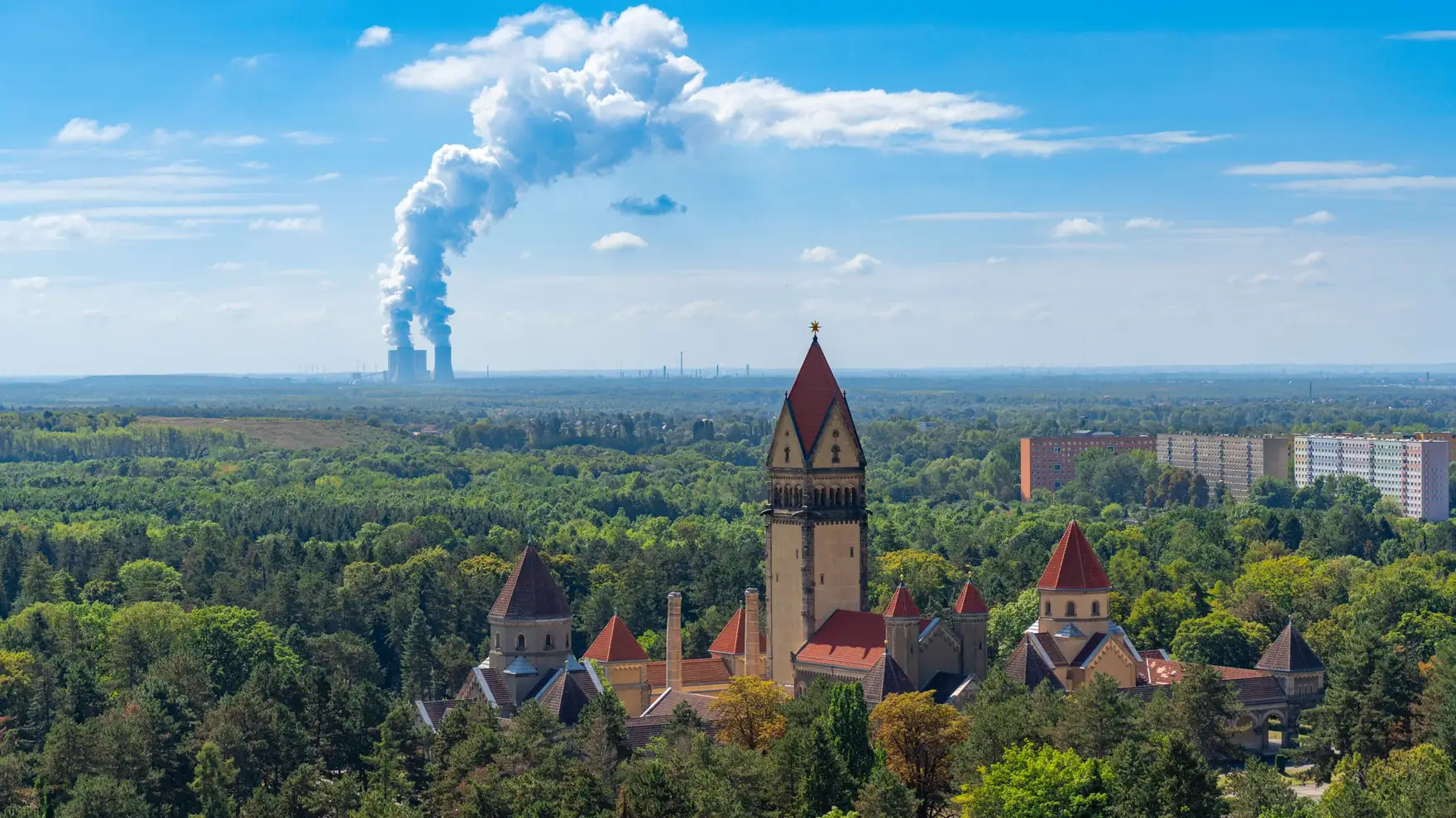 Aerial view of Leipzig with prominent incineration plant. Contrasting urban and green scenery