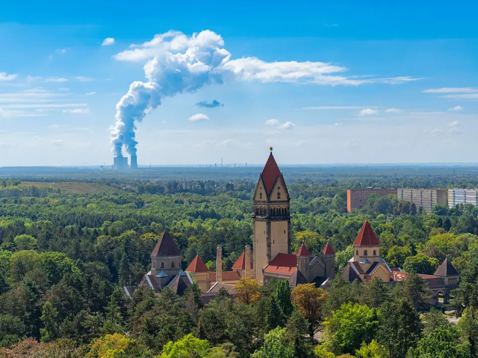 Aerial view of Leipzig with prominent incineration plant. Contrasting urban and green scenery