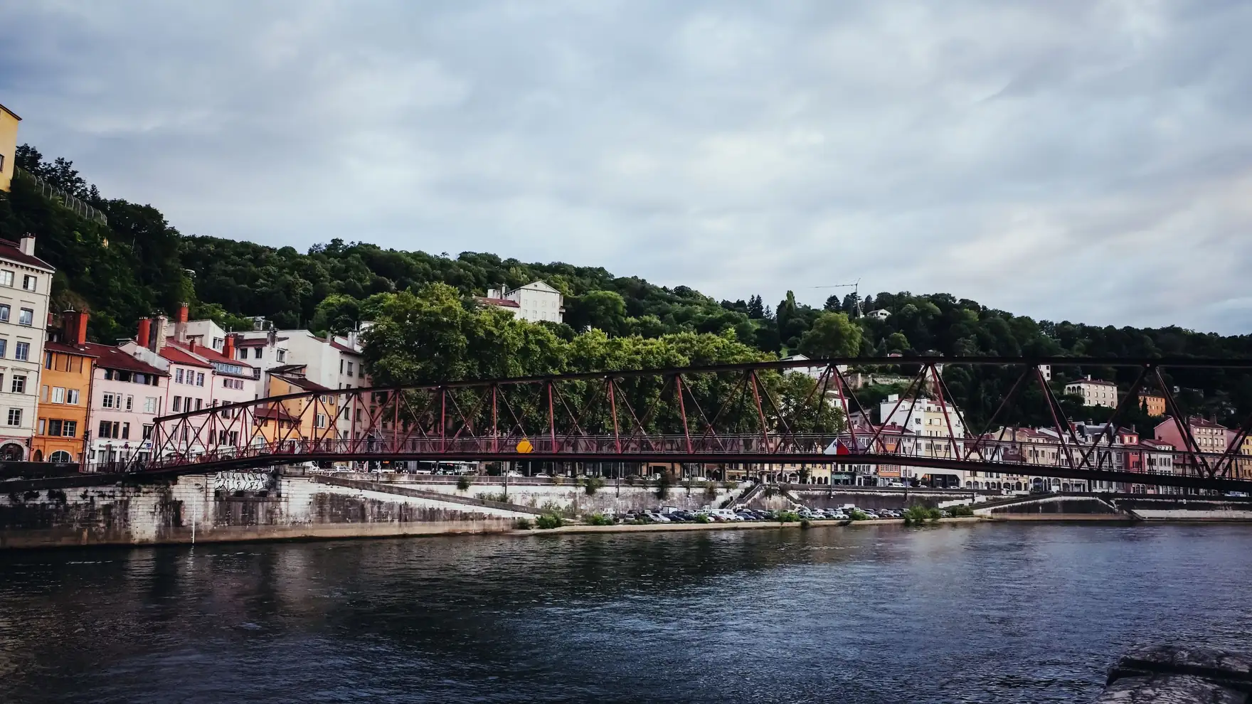 Picturesque view of a historic footbridge over the Saône River in Lyon, France