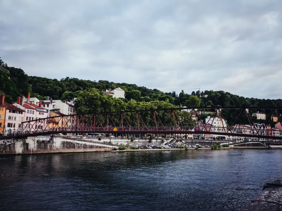 Picturesque view of a historic footbridge over the Saône River in Lyon, France
