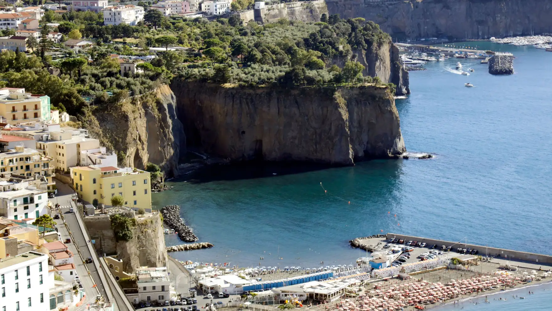 Stunning aerial shot of Sorrento's cliffs and beach in Naples, Italy, with vibrant sea views