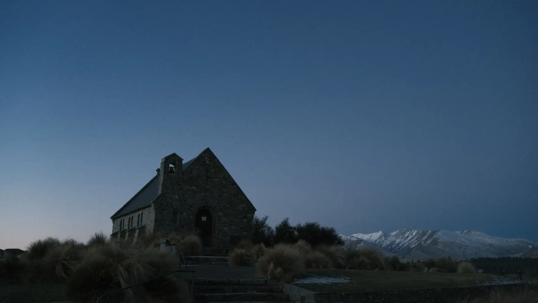 Tranquil evening at Church of the Good Shepherd, Lake Tekapo, New Zealand with twilight sky