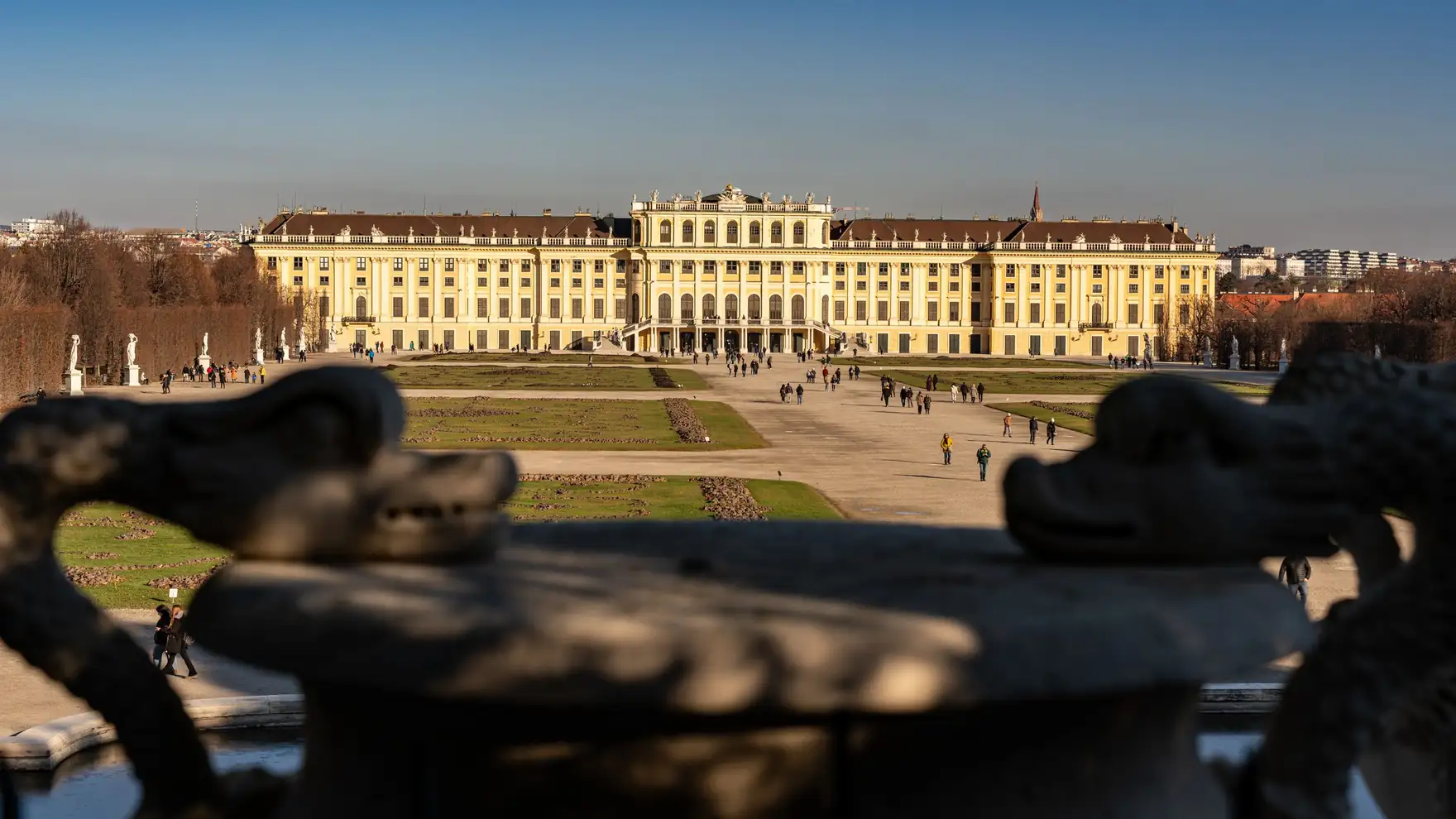 Stunning view of Schonbrunn Palace in Vienna captured from its gardens under a clear blue sky