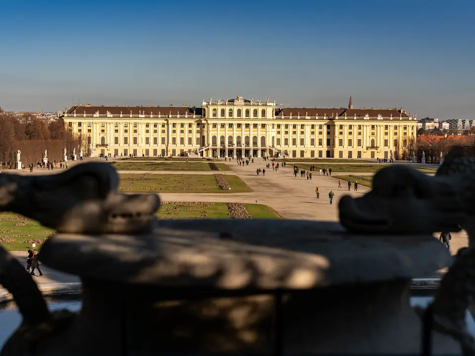 Stunning view of Schonbrunn Palace in Vienna captured from its gardens under a clear blue sky